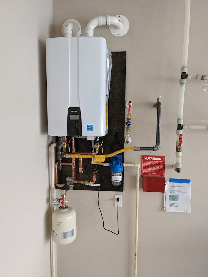 Professional plumber installing copper piping in a Paris home